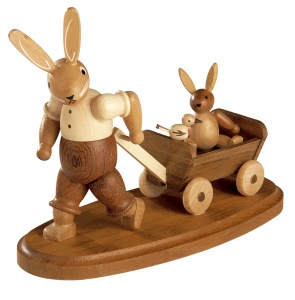 Easter bunny, male, with child on wooden handcart